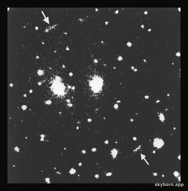 Bright X-Ray cluster acts as strong gravitational lens