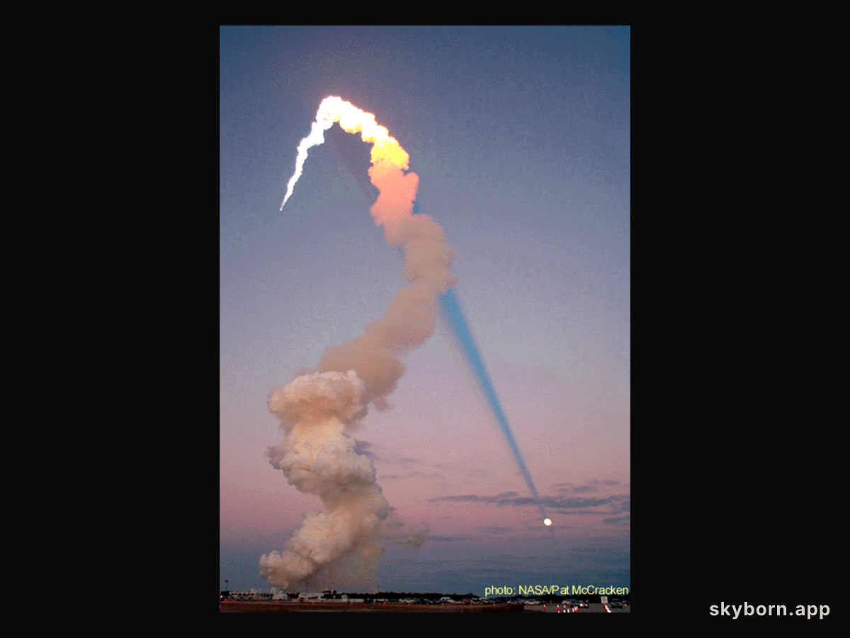 Shuttle Plume Shadow Points to Moon