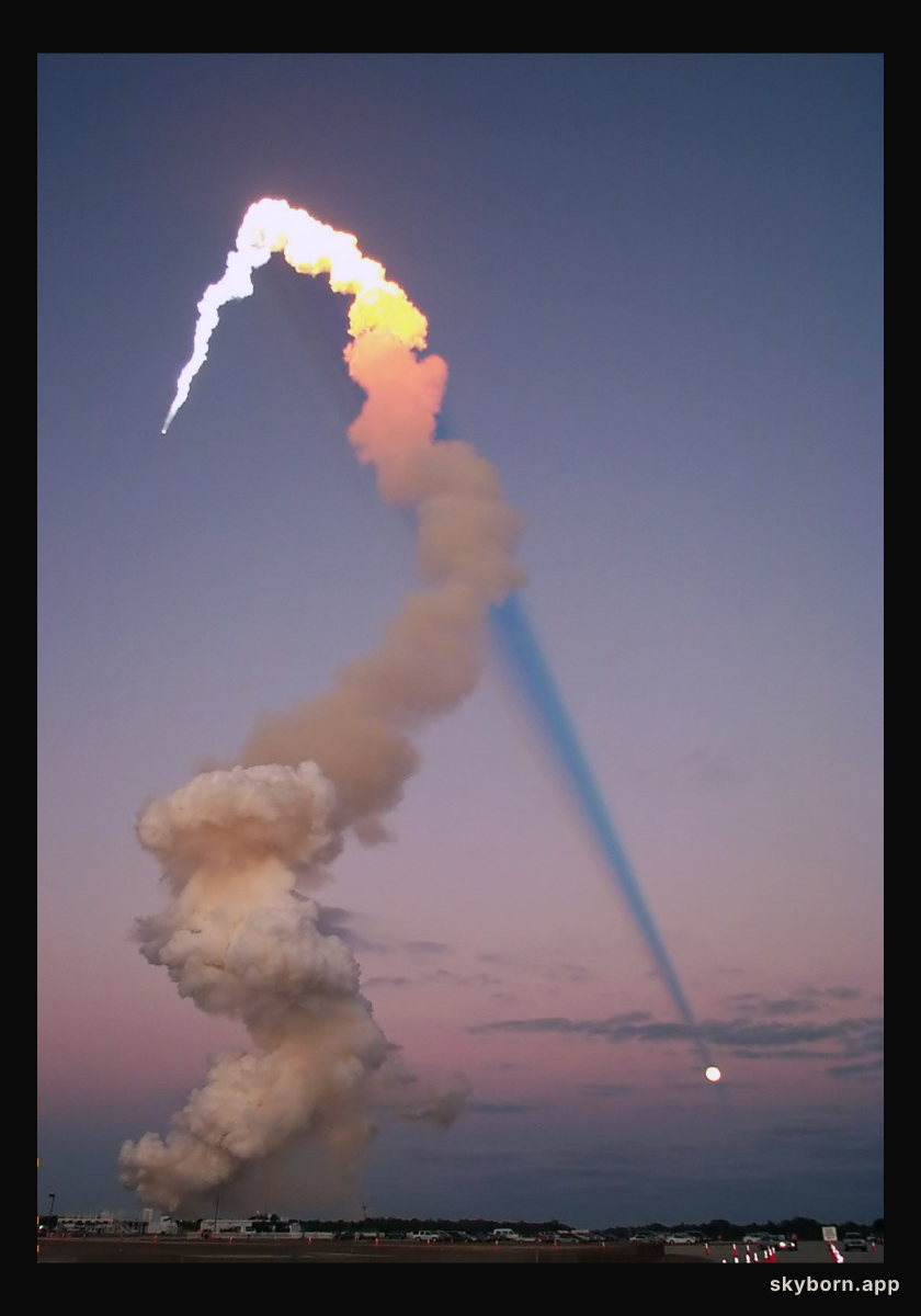Shuttle Plume Shadow Points to Moon