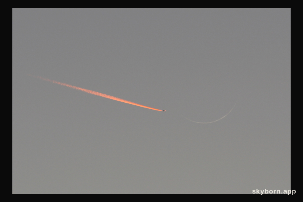 Jet Approaching a Crescent Moon