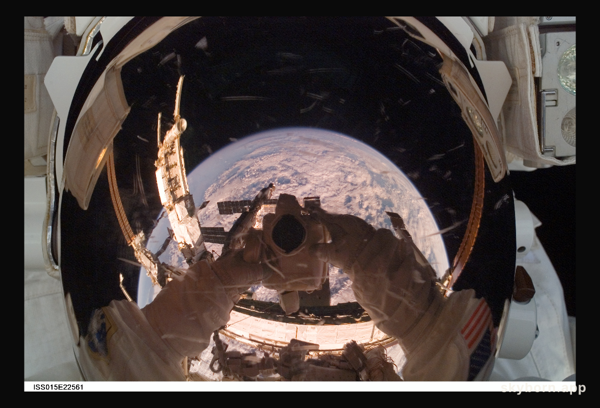 Orbiting Astronaut Reflects Earth
