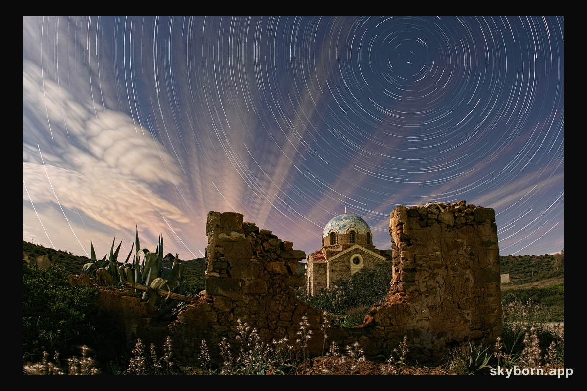 Illuminated Cloud Trails Above Greece