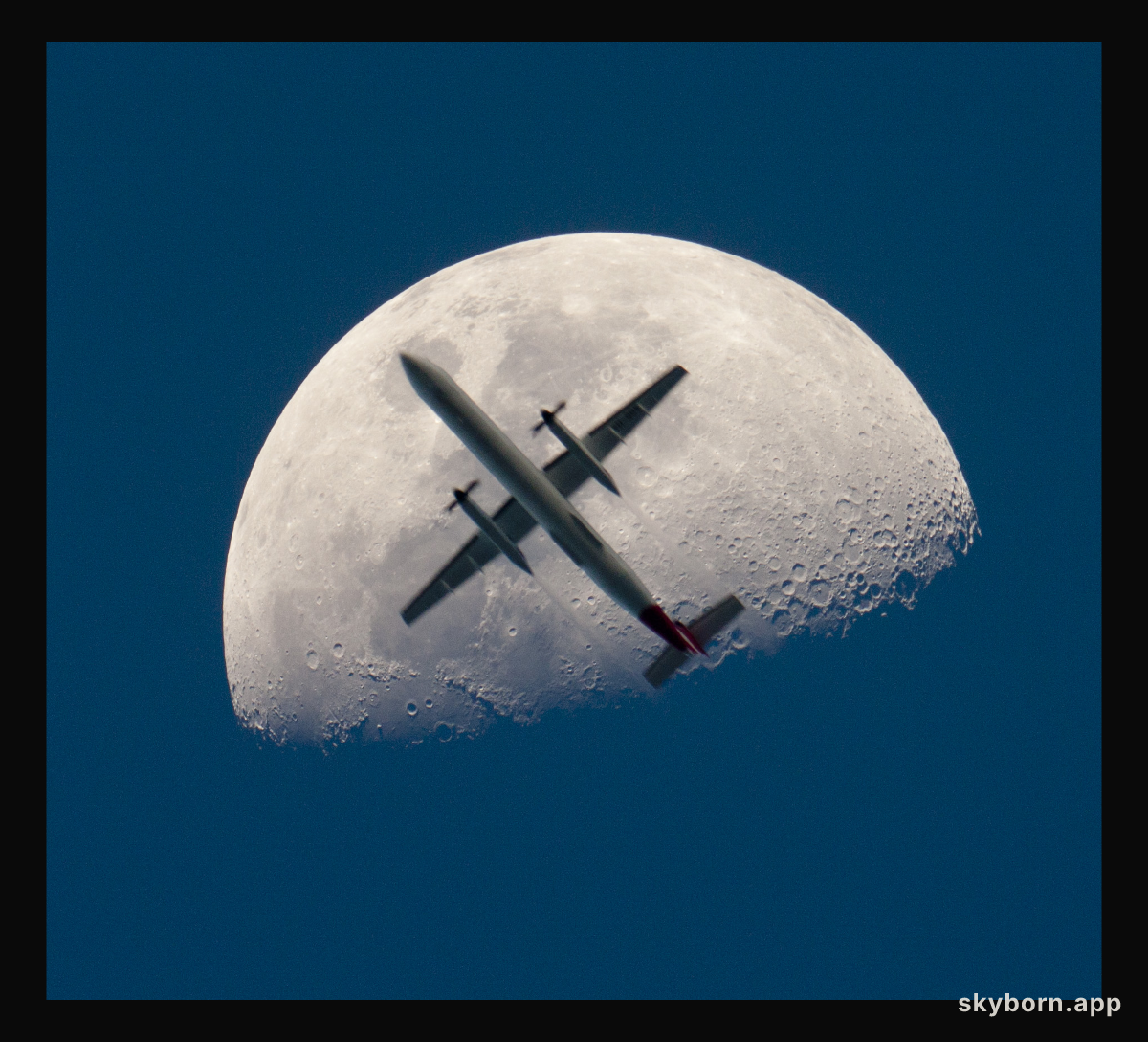 An Airplane in Front of the Moon