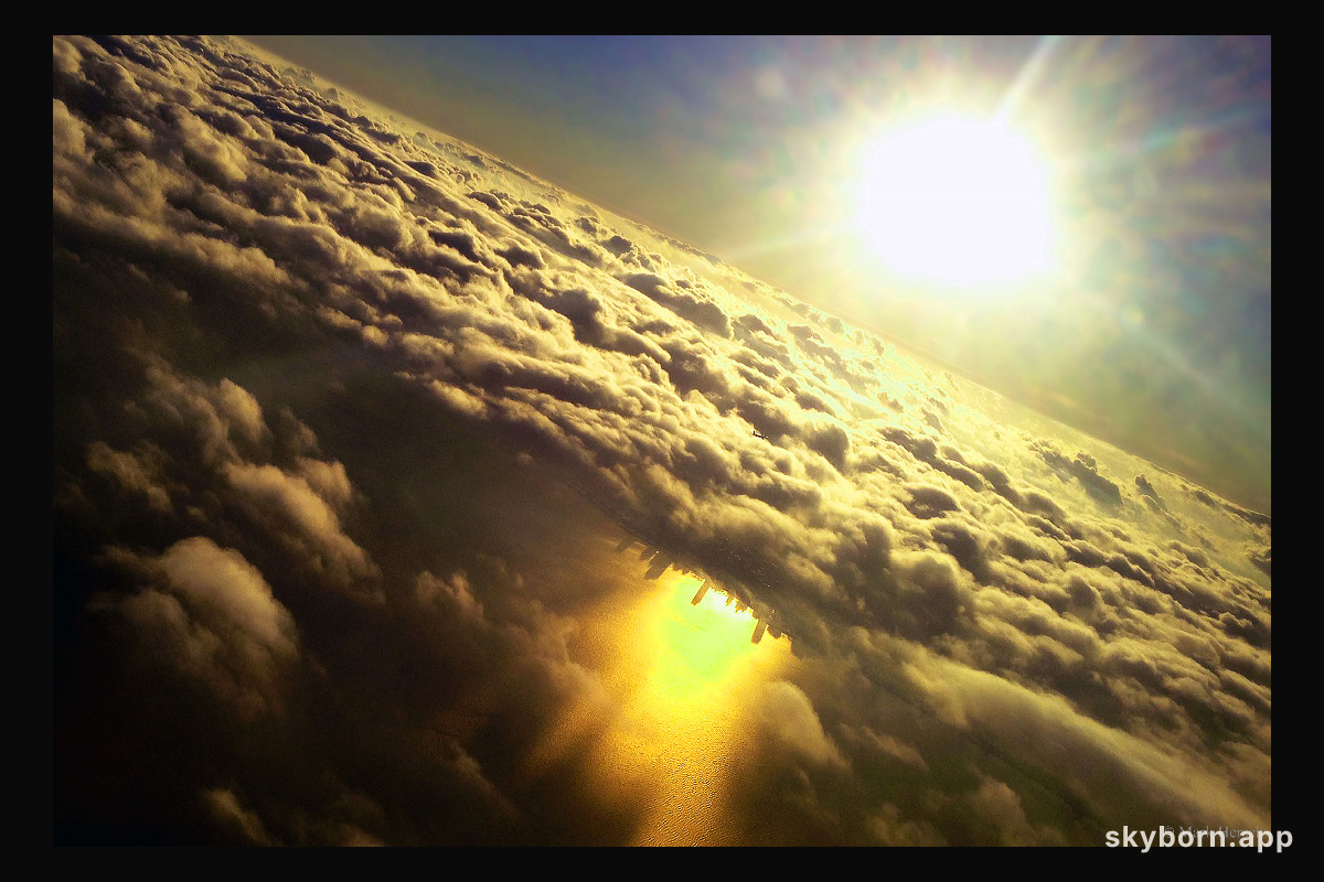Inverted City Beneath Clouds