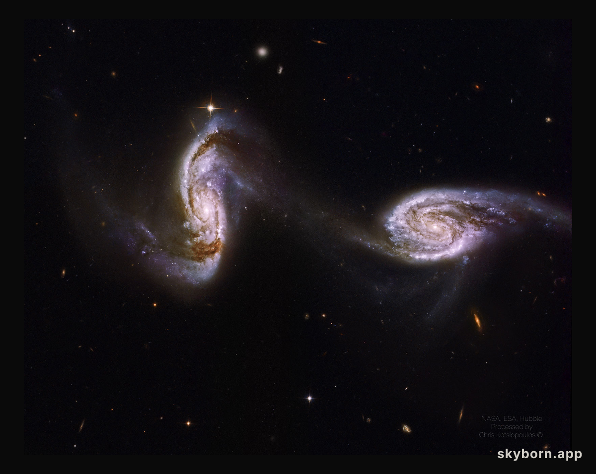 Arp 240: A Bridge between Spiral Galaxies from Hubble