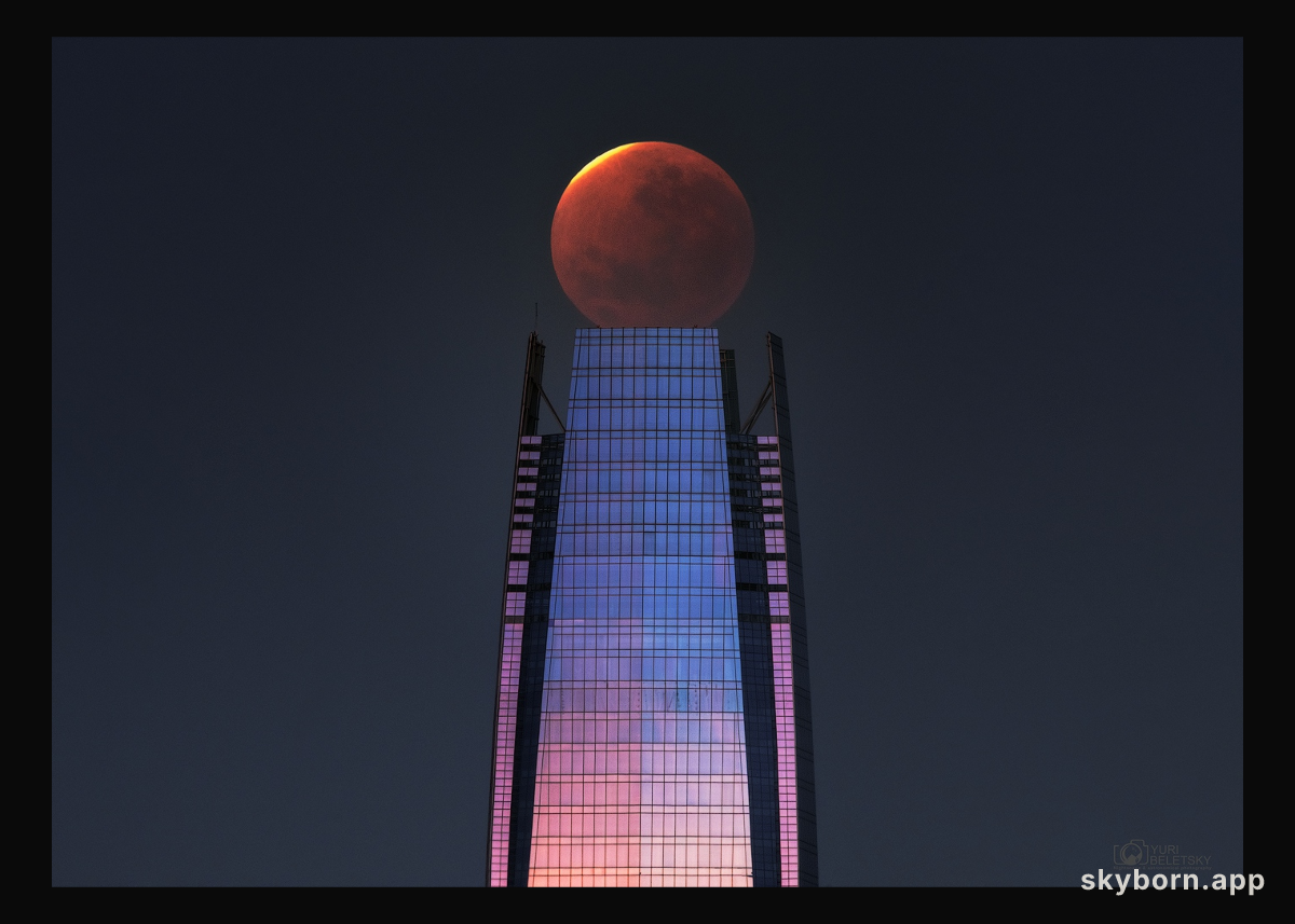 Lunar Eclipse over a Skyscraper