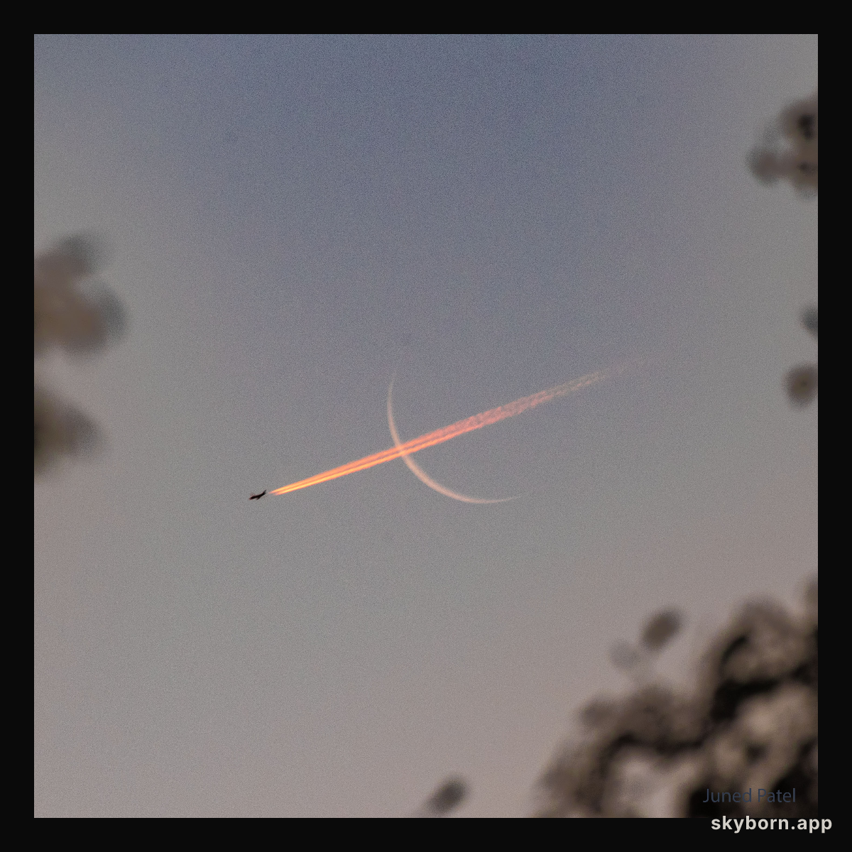 Plane Crossing Crescent Moon