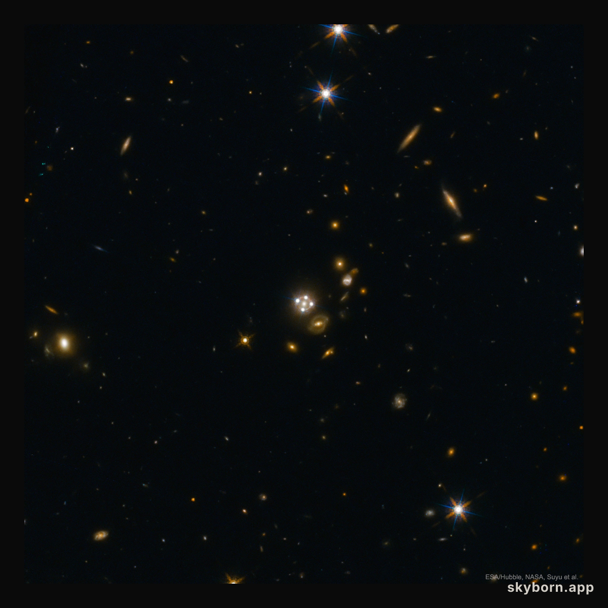 Four Quasar Images Surround a Galaxy Lens