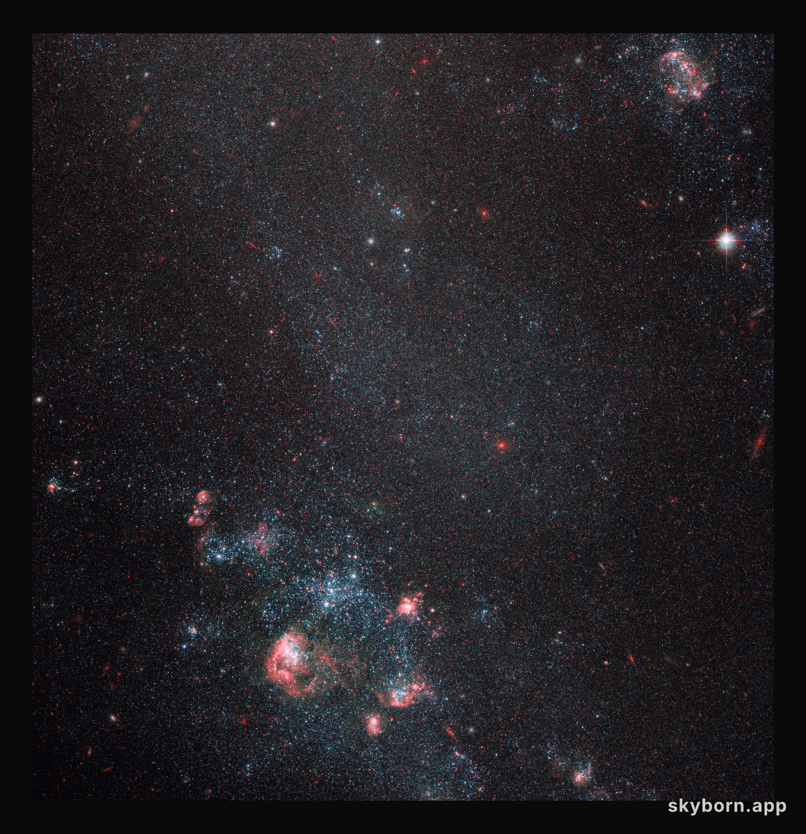 Faint galaxy with popping pink features