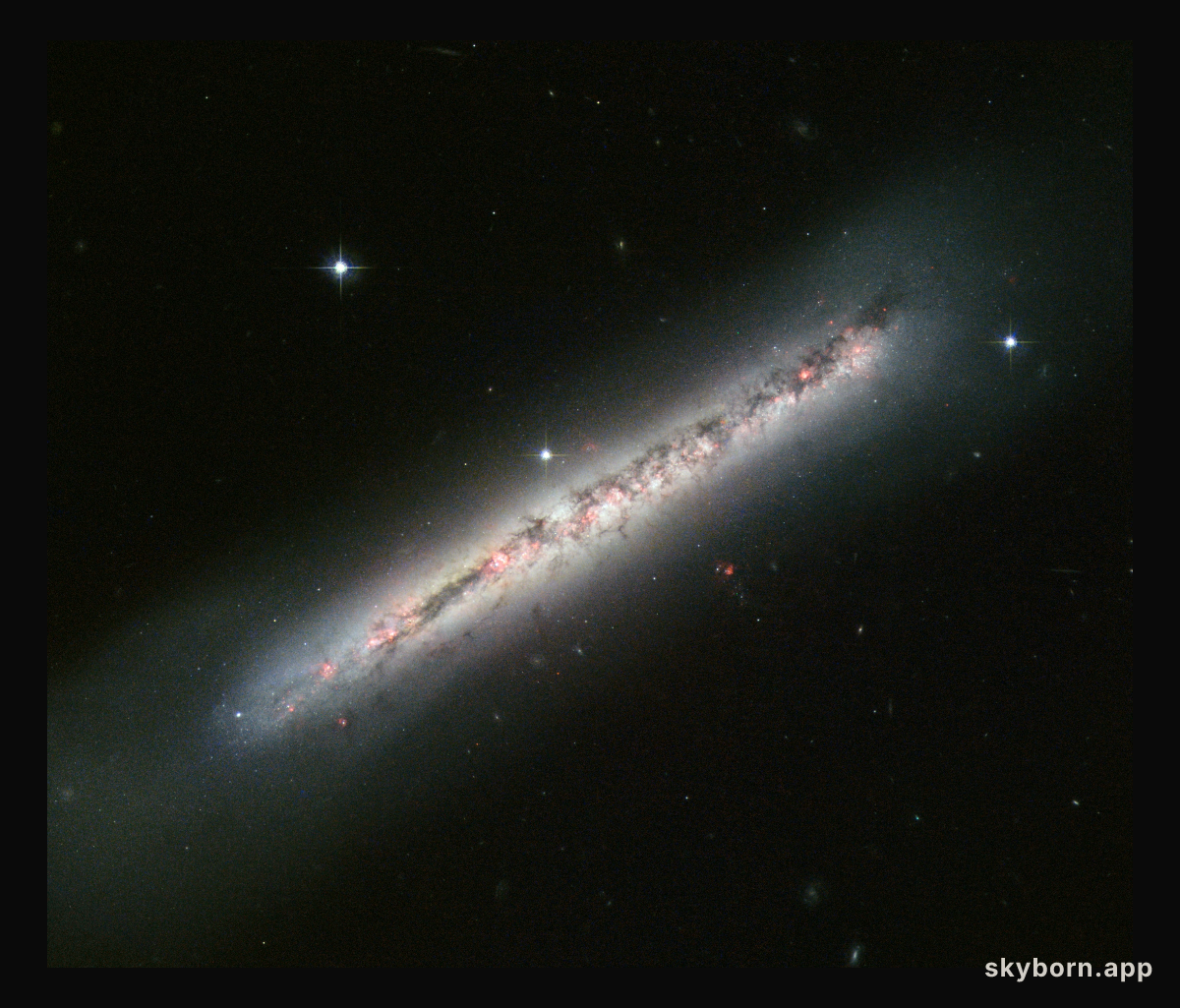 Glowing gas and dark dust in a side-on spiral
