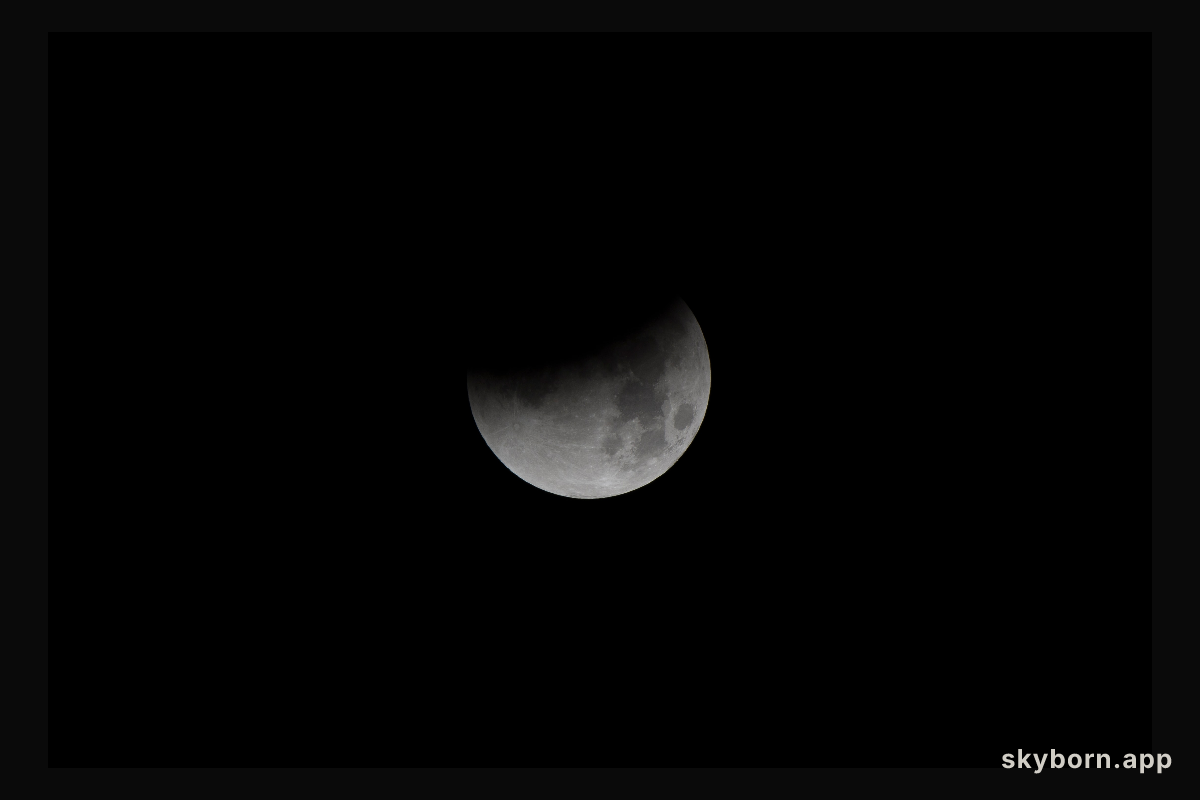 NASA photographer captures Super Blue Blood Moon beginning its eclipse January 31 from NASA's Armstrong Flight Research Center on the West Coast.