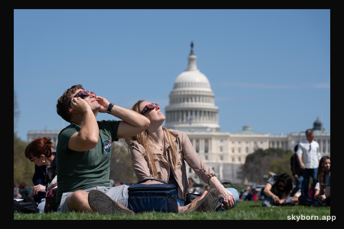 Neil Tublin and Reigna Pierce view the partial solar eclipse in Washington, DC, Monday, April 8, 2024