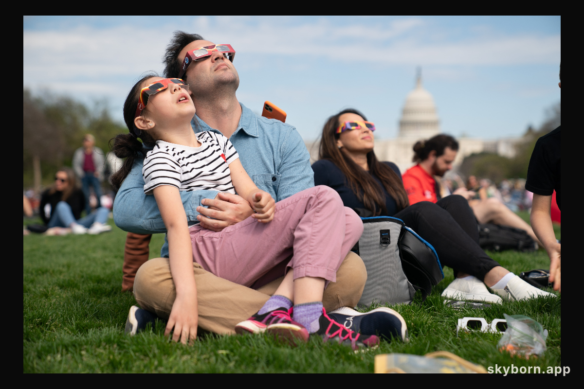 Miranda (9) and Cameron Dyal view a partial solar eclipse in Washington, DC, Monday, April 8, 2024