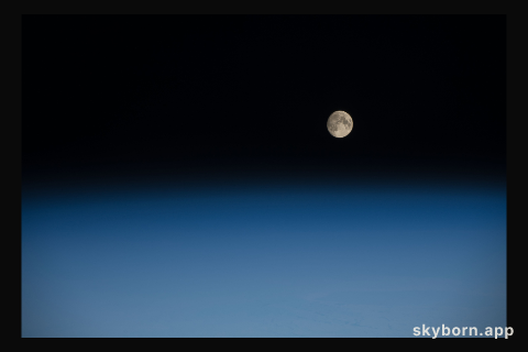 A waxing gibbous moon was pictured above the Earth's limb as the International Space Station orbited over the southern
