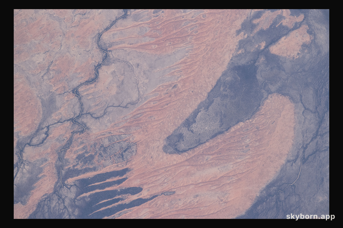 A portion the Innamincka Regional Reserve, surrounded by the Strzlecki Desert, is seen in the northeast part