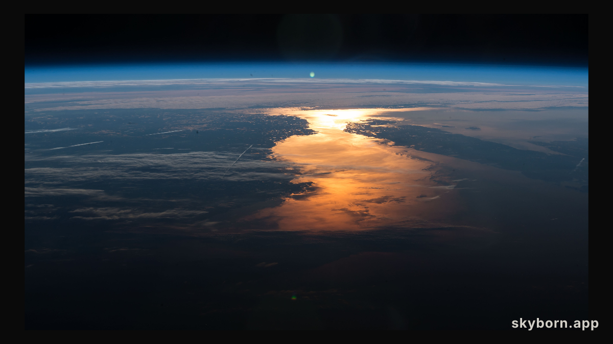 The International Space Station orbited over New England and across Canada capturing the Sun's glint on the North