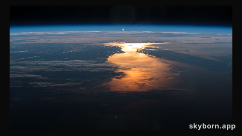 The International Space Station orbited over New England and across Canada capturing the Sun's glint on the North