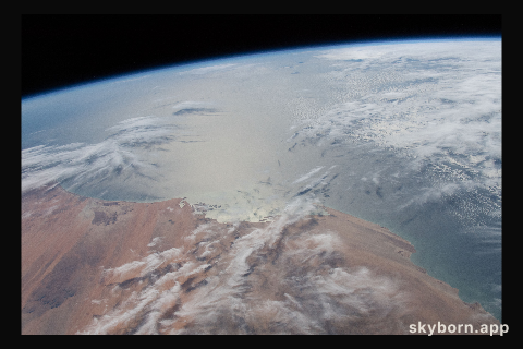 The Sun's glint radiates off the Atlantic Ocean