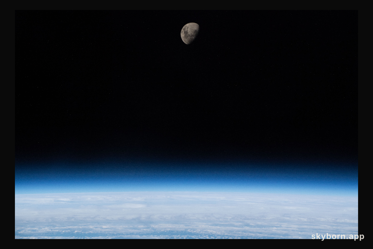 The waxing gibbous moon is pictured above Earth's limb as the International Space Station was orbiting 266 miles
