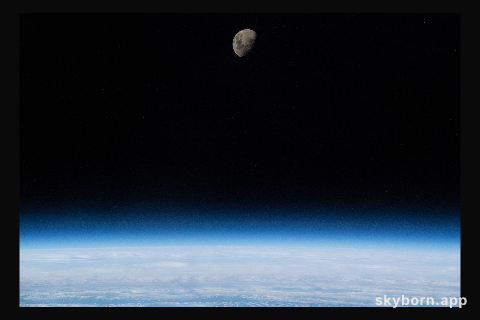 The waxing gibbous moon is pictured above Earth's limb as the International Space Station was orbiting 266 miles