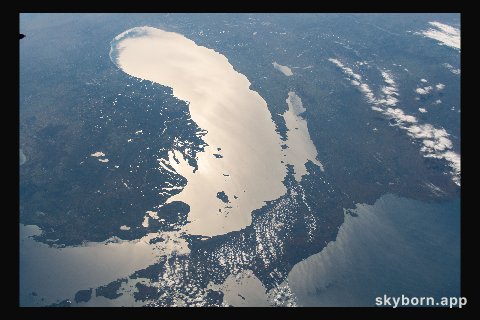 The Sun's glint beams off Lake Michigan in this southward view taken from the International Space Station orbiting 253