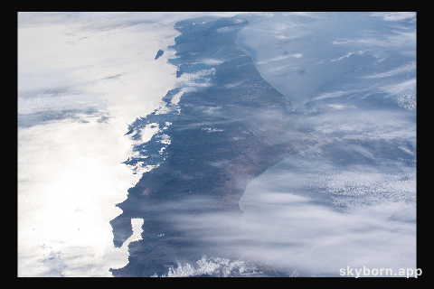 Baja California, with the Sun's glint beaming off the Gulf of California, is pictured as the International Space