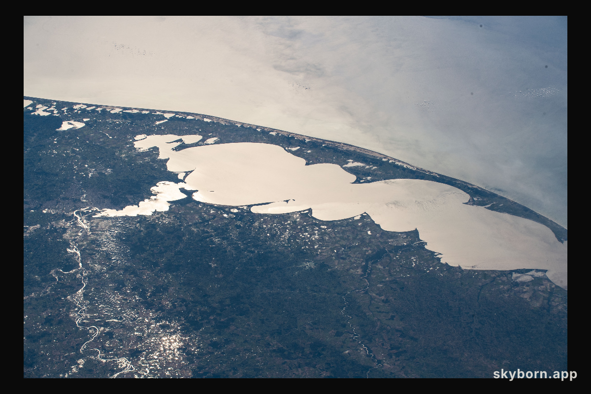 The Sun's glint beaming off Brazil's largest lagoon, Lagos dos Patos, on the nation's southernmost tip is pictured