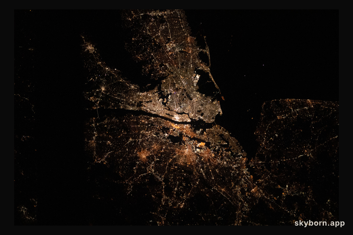 The bright city lights of Long Island, New York City and the New Jersey area contrast the dark waters of Sandy Hook