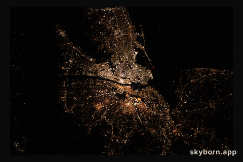 The bright city lights of Long Island, New York City and the New Jersey area contrast the dark waters of Sandy Hook