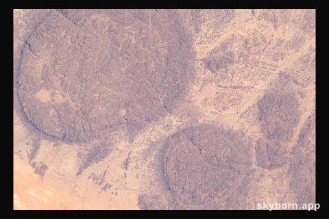 The near-circular massifs of the Aïr Mountains within the Sahara Desert were pictured from the International Space