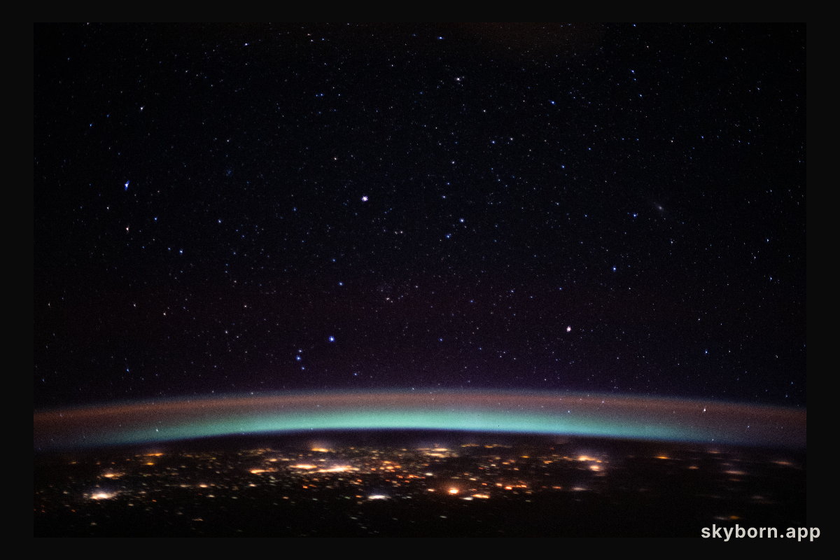 The city lights at the intersection of Europe and Asia sparkle underneath an atmospheric glow and a starry night sky