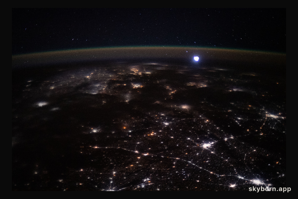 The city lights of western India and Pakistan spread across the subcontinent like a glittering web as the International