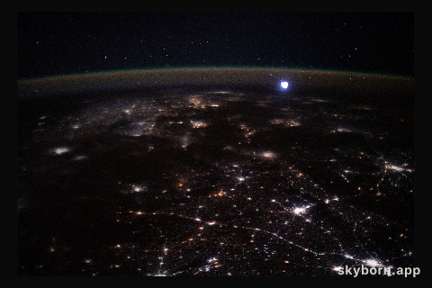 The city lights of western India and Pakistan spread across the subcontinent like a glittering web as the International