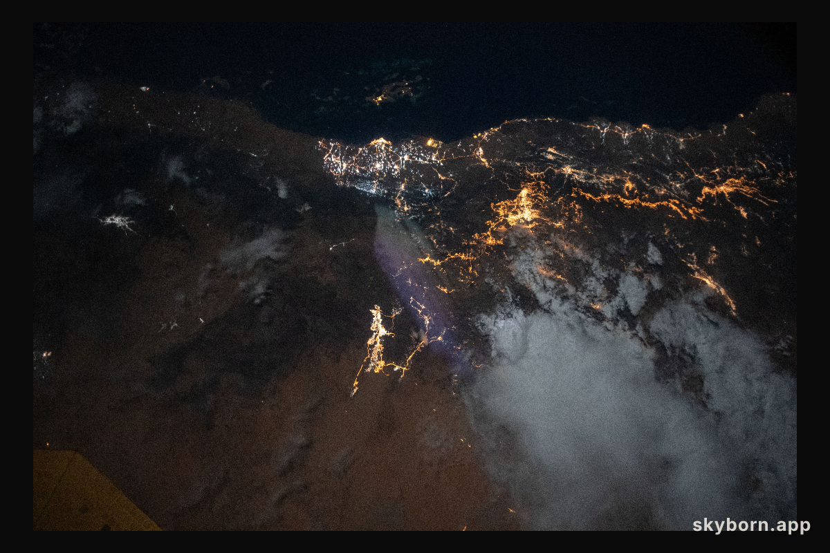The city lights of Jazan (top center) and its suburbs on the Persian Gulf coast of Saudi Arabia are easily visible