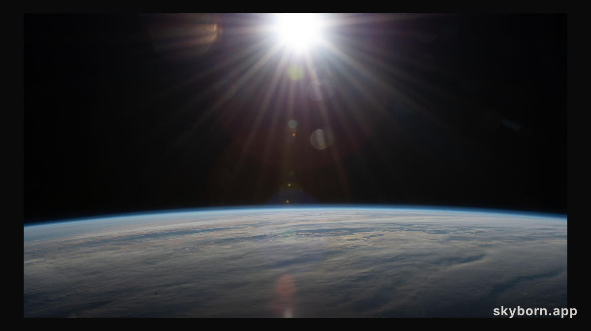 The sun's rays glisten in this photograph from an external high definition camera as the International Space Station