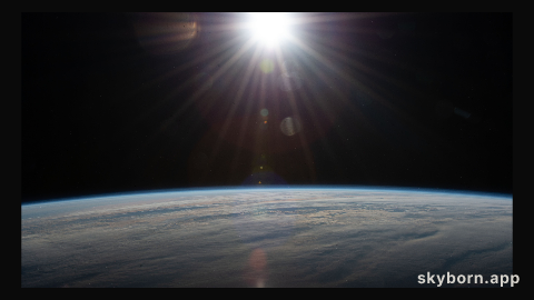 The sun's rays glisten in this photograph from an external high definition camera as the International Space Station