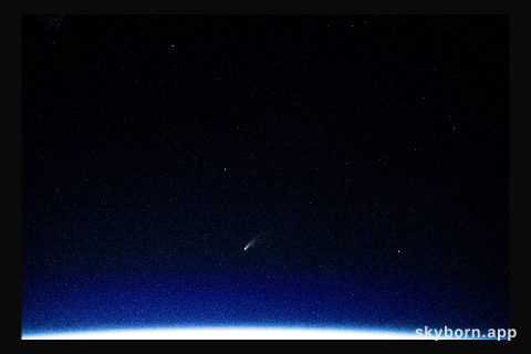 The tiny shooting star in the lower center of this image is Comet Neowise pictured from the International Space Station