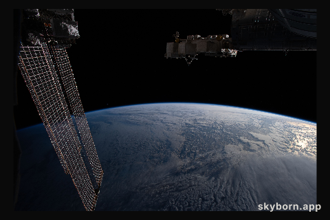 The Earth's limb, or horizon, is pictured as the International Space Station orbited above the north Pacific near