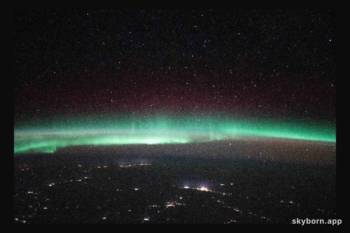 A starry night sky and an aurora are pictured above Russia, in between Ukraine and Kazakhstan, as the International
