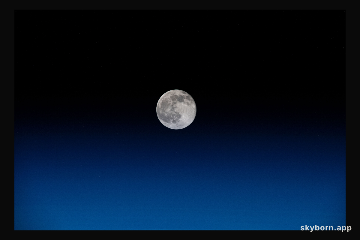 The waning gibbous moon is pictured the day after its full Moon phase as the International Space Station orbited 264