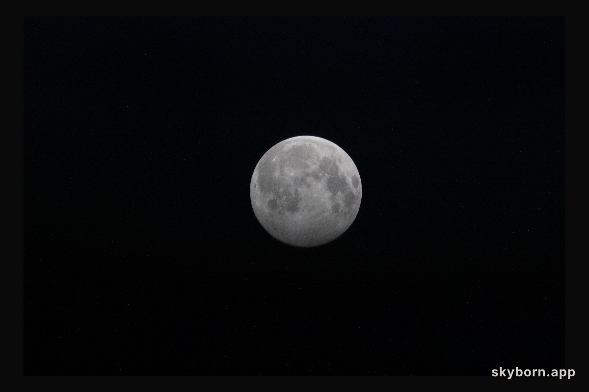 A Full Moon is pictured above the Earth's horizon as the International Space Station orbited 264 miles over Russia