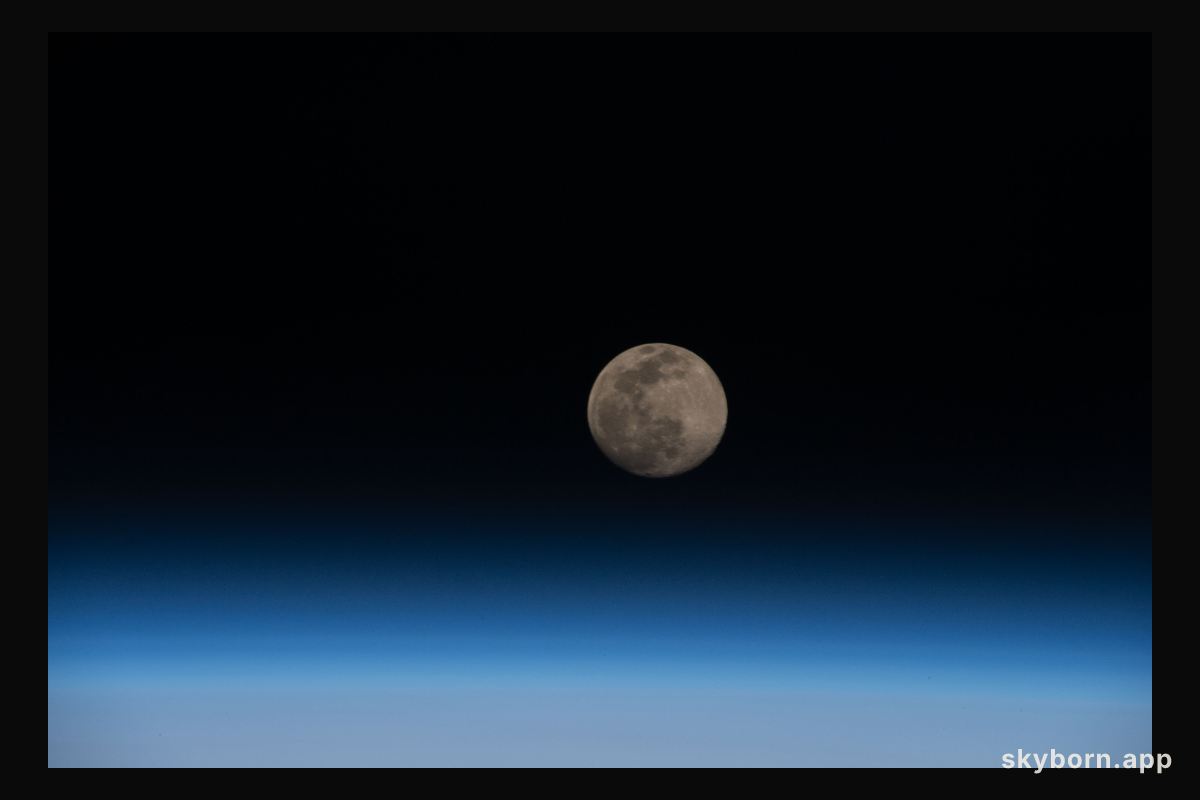 A Full Moon is pictured above the Earth's horizon as the International Space Station orbited 264 miles over the East