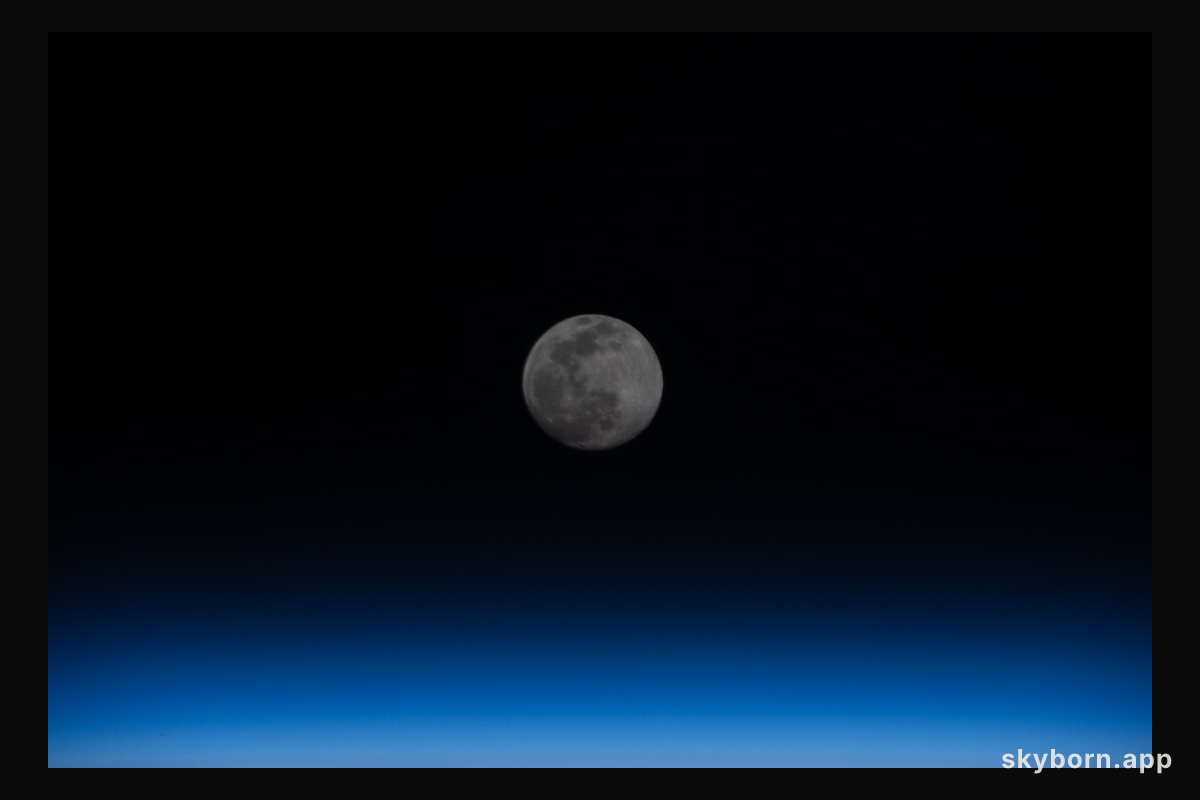 A Full Moon is pictured above the Earth's horizon as the International Space Station orbited 262 miles over eastern Iran