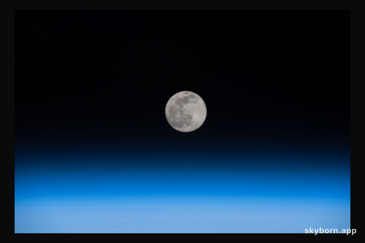 A Full Moon is pictured above the Earth's horizon as the International Space Station orbited 262 miles over China