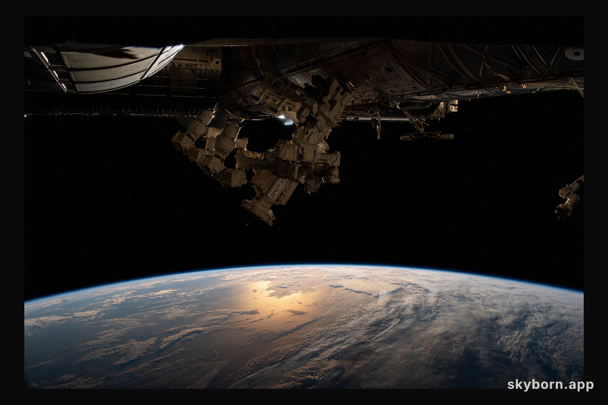 The sun's glint beams off the Atlantic Ocean as the International Space Station soared 271 miles above the southern