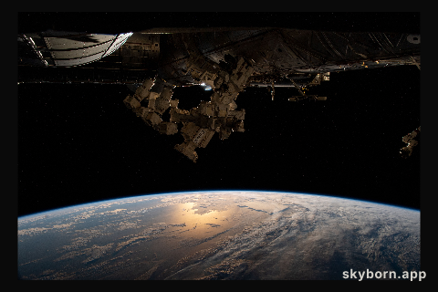 The sun's glint beams off the Atlantic Ocean as the International Space Station soared 271 miles above the southern