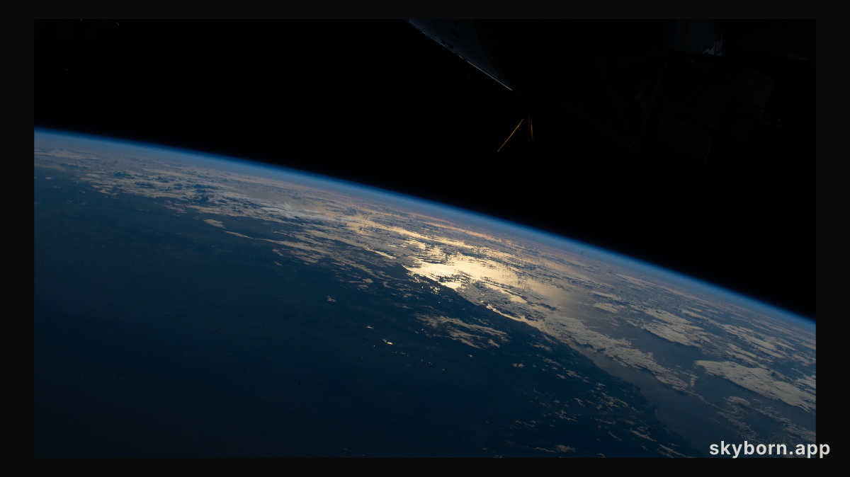 The sun's glint beams off the Tasman Sea on the southeastern coast of New South Wales, Australia, as the International