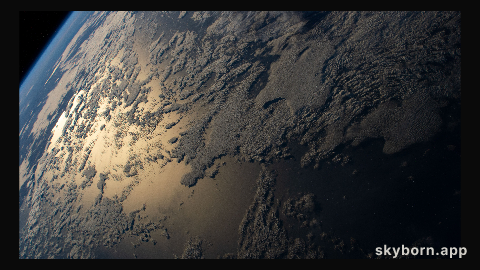 The sun's glint beams off the Indian Ocean as the International Space Station orbited 269 miles above south of Western