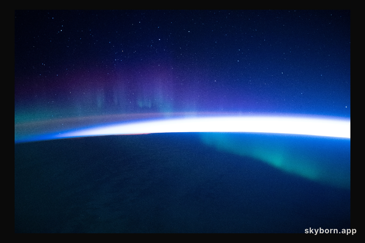 A faint aurora beneath a starry sky is pictured from the International Space Station as it orbited 273 miles