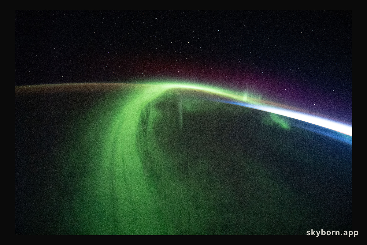 A vivid aurora streams over the Earth as the International Space Station orbited 273 miles above the southern Indian